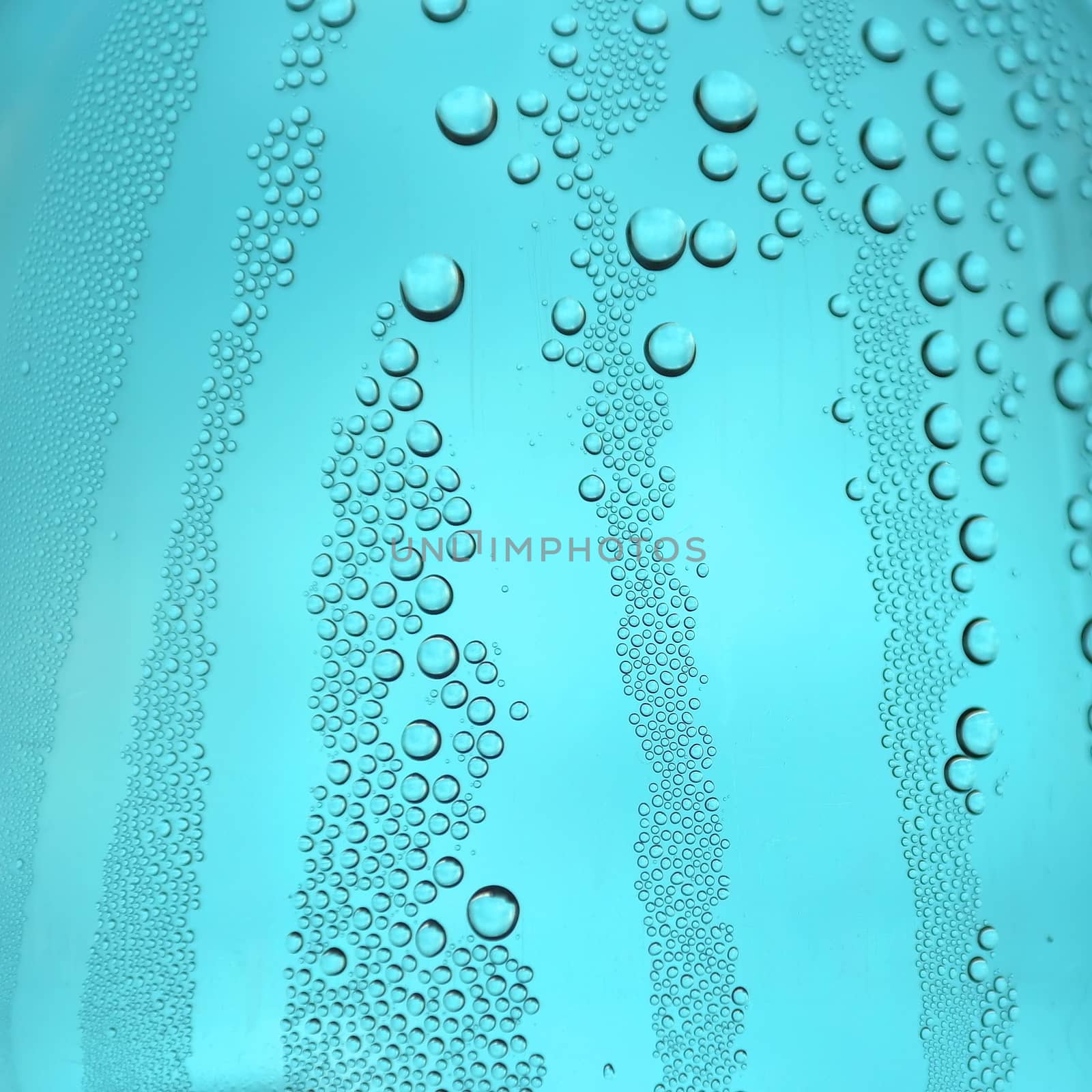 Drops of water on the crooked glass, shallow dof