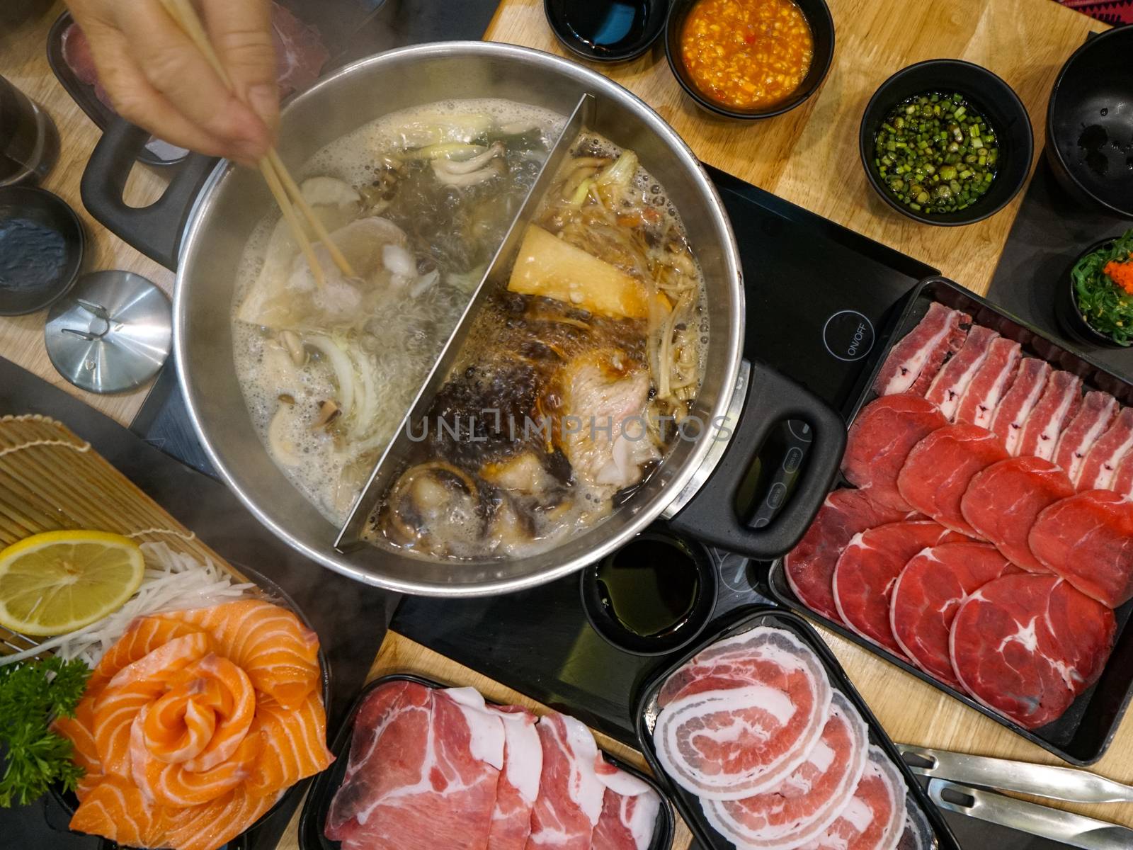 Shabu-Shabu a Japanese hotpot dish of thinly sliced meat and vegetables boiled in water.