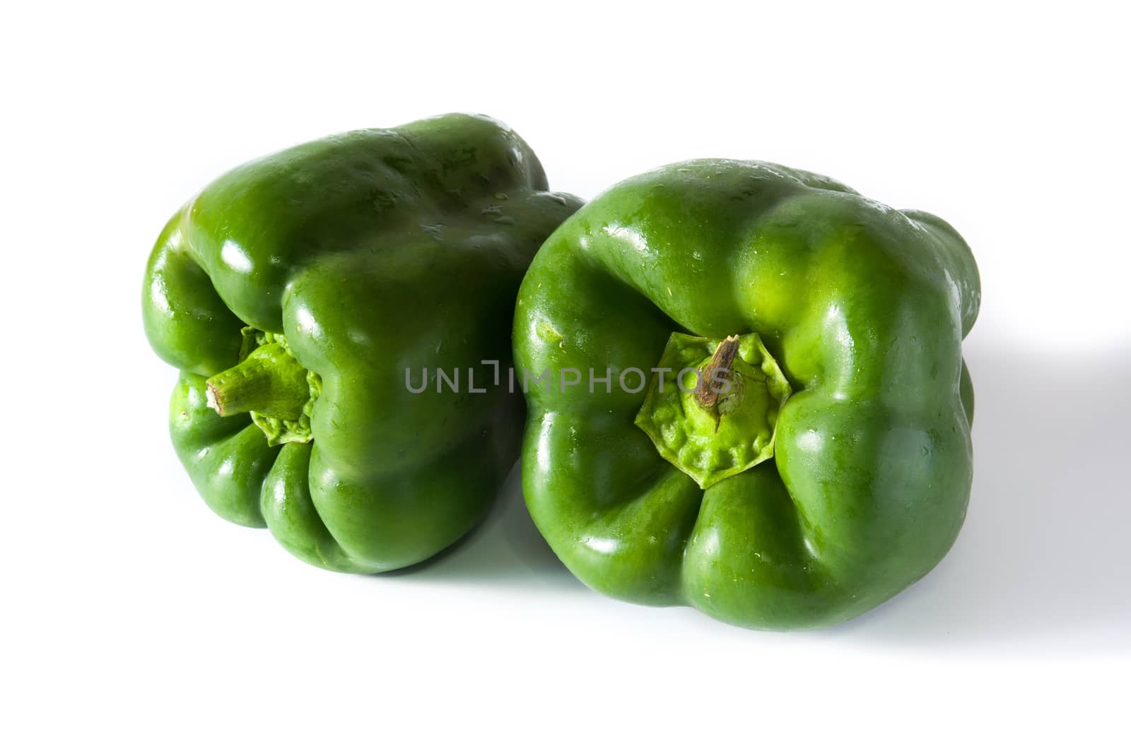 Fresh green peppers isolated on white background