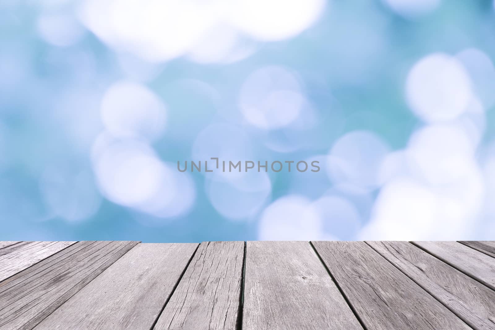 Old wooden floor with blue blurred background. by Eungsuwat