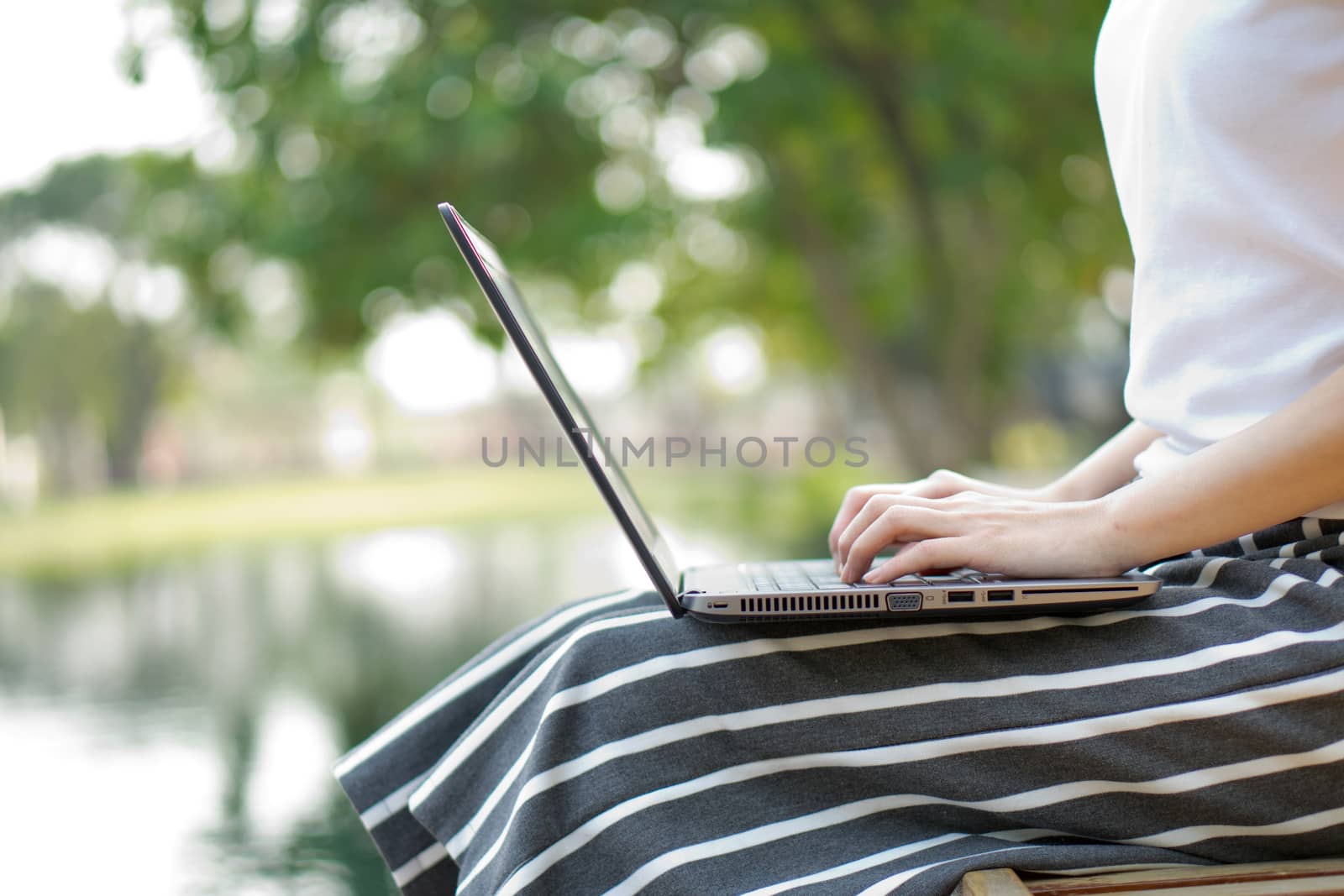 Beautiful young woman using laptop