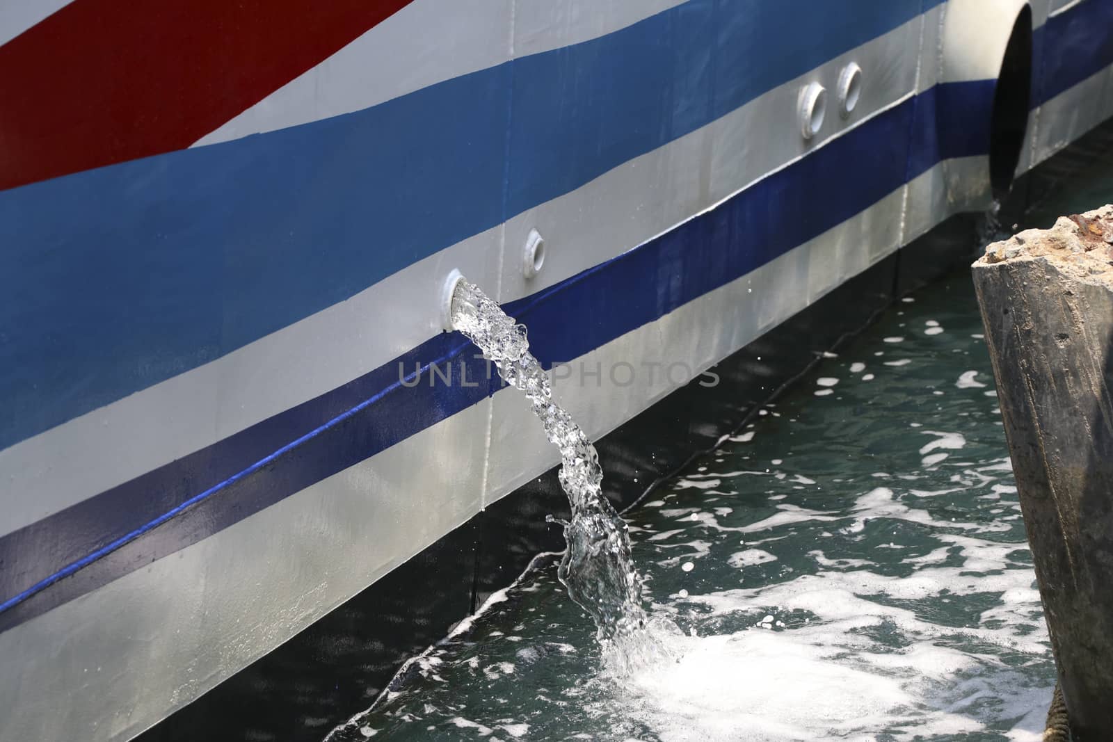 Water that was pumped out of the boat while parked at the pier. Water that was taken out of the ship.