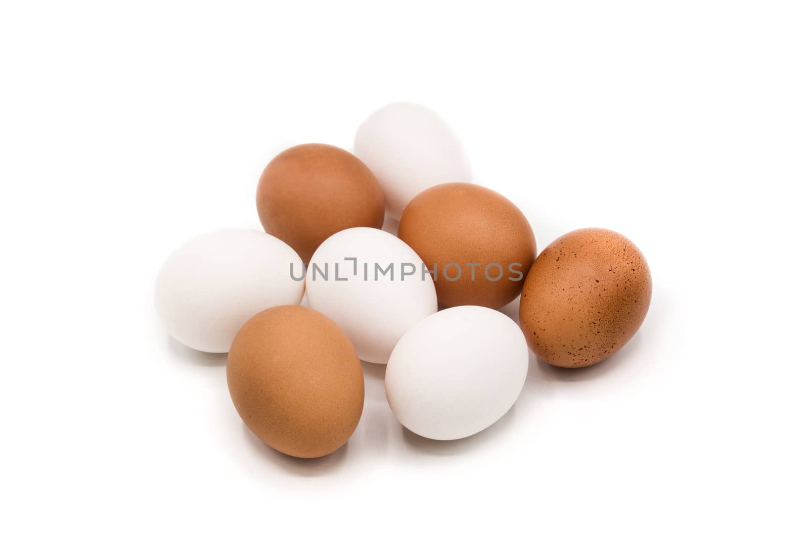 Brown and white eggs isolated on white background