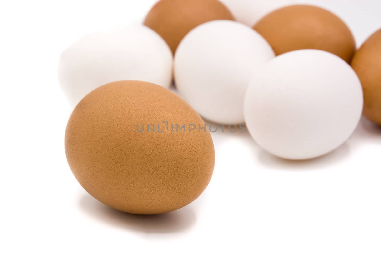 Brown and white eggs isolated on white background