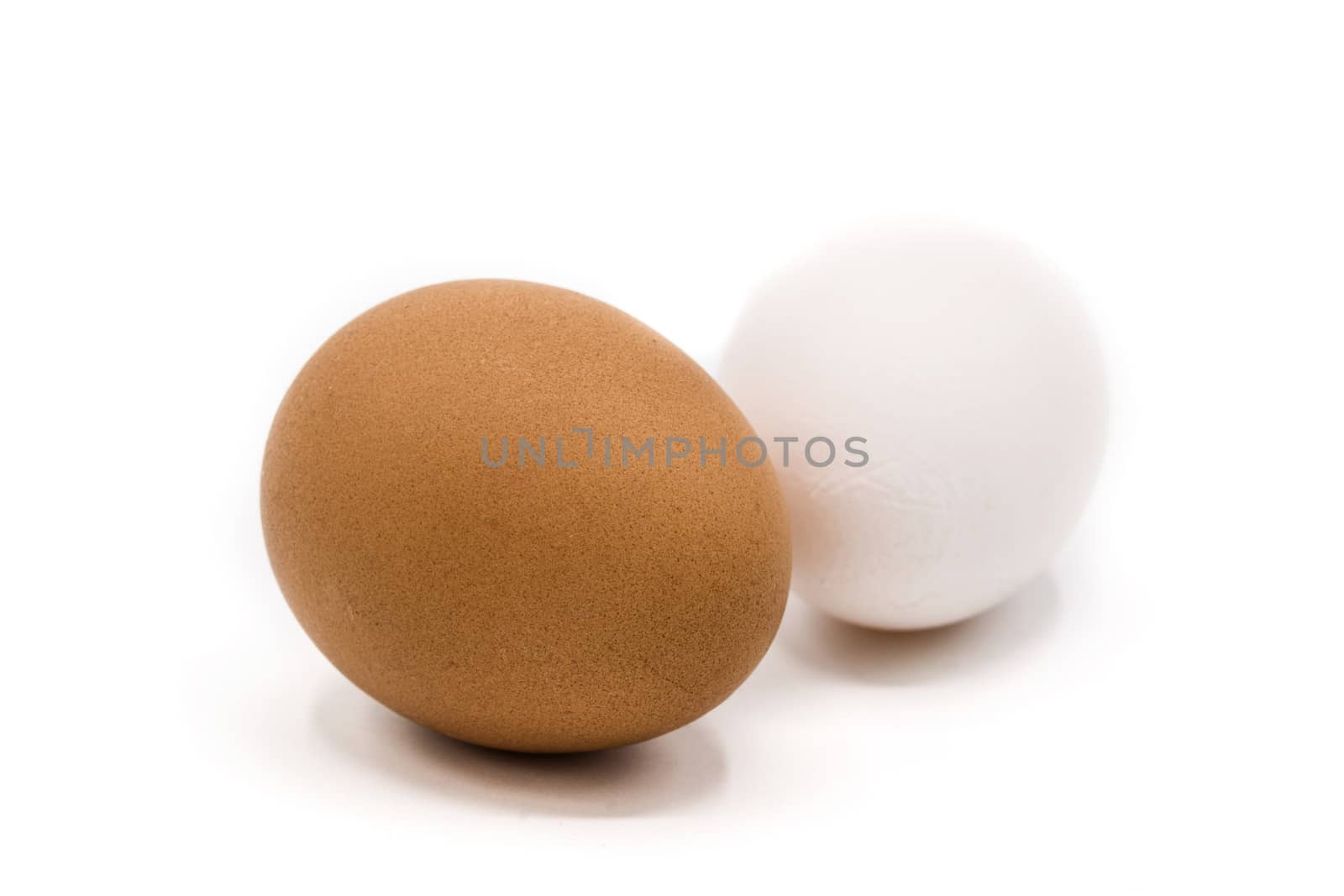 Brown and white eggs isolated on white background
