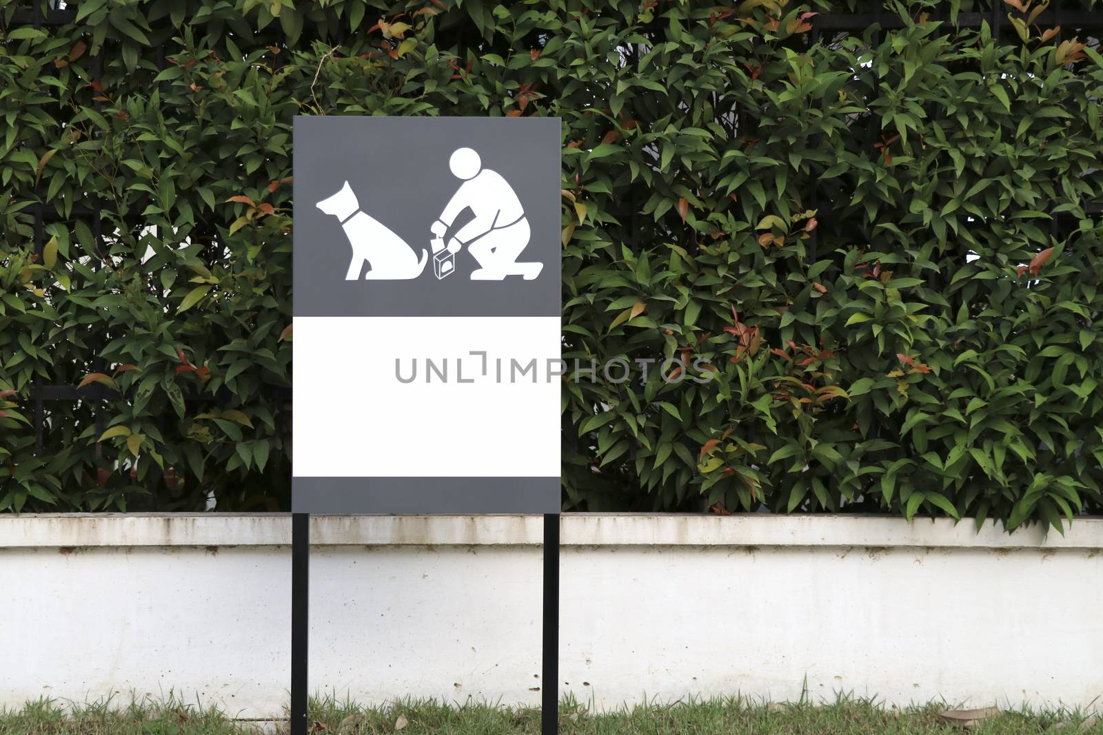 The sign shows the cleanliness when pets excrete in the village area. by Eungsuwat