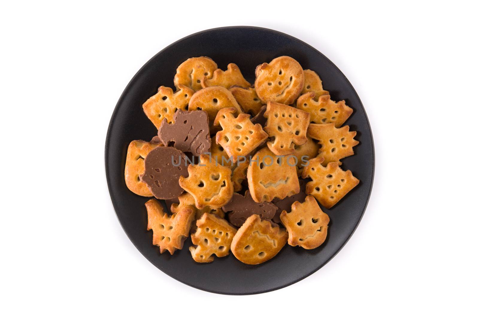 Halloween cookies on black plate isolated on white background
