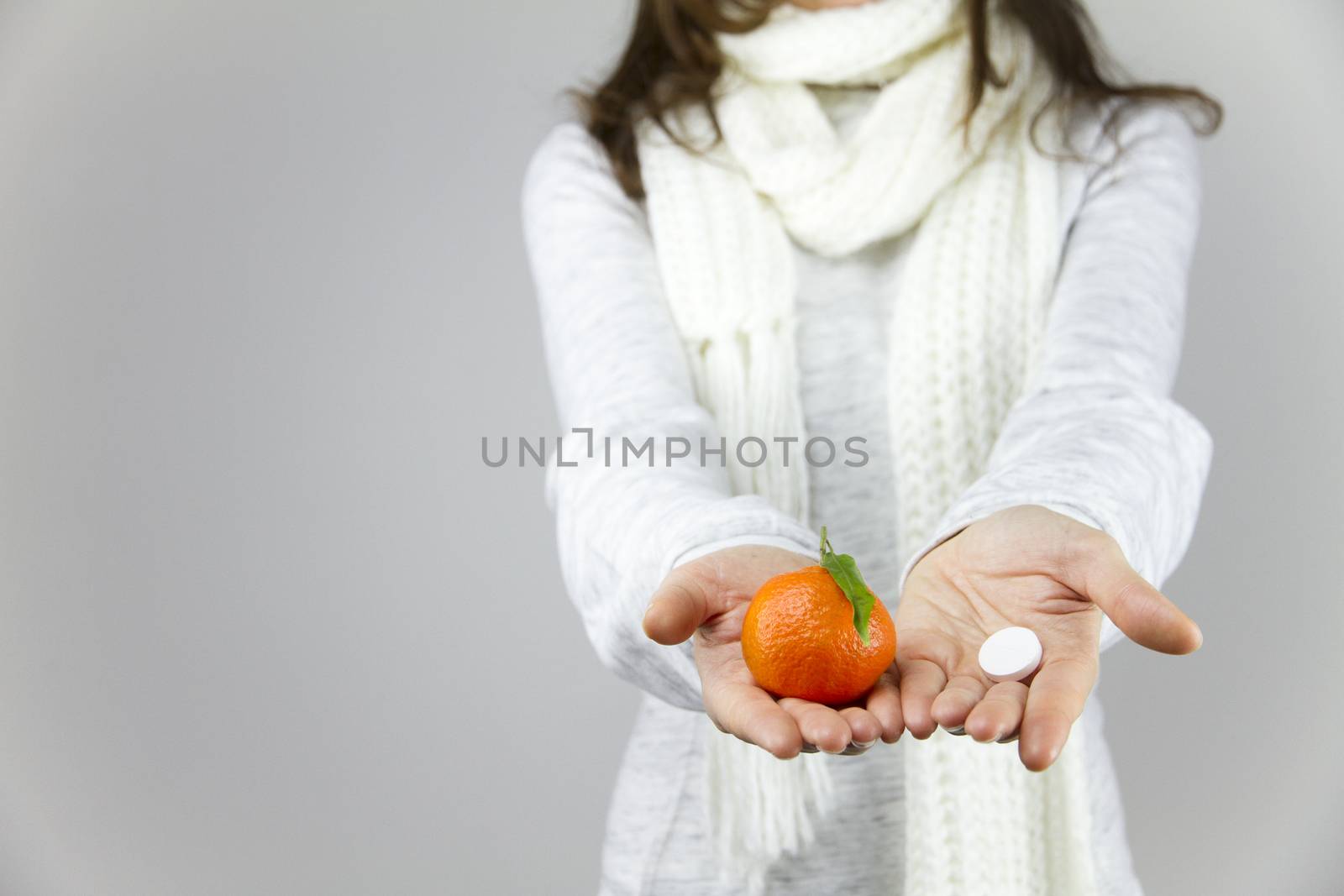 Vitamins from fruit or drugs? A sick young woman with a scarf on by robbyfontanesi