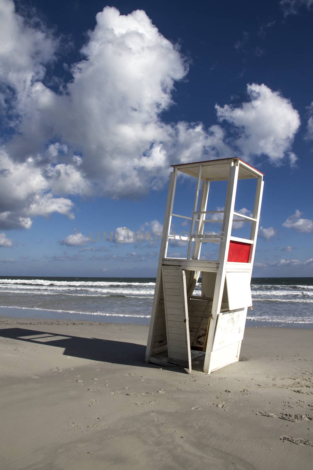 Watchtower in the winter sea. After a whole season of work helping the man in his surveillance task, he rests on his side, abandoned to the bad weather of the sea.