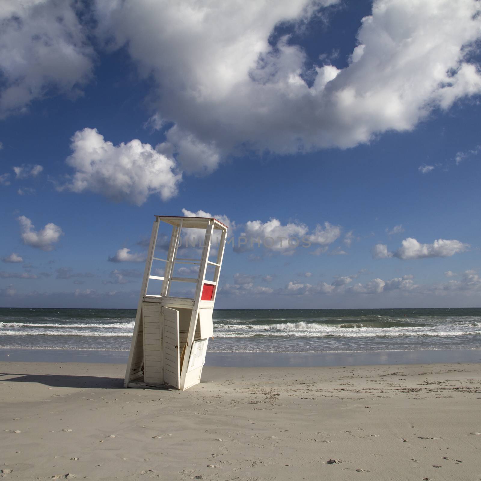 Watchtower in the winter sea. After a whole season of work helping the man in his surveillance task, he rests on his side, abandoned to the bad weather of the sea.