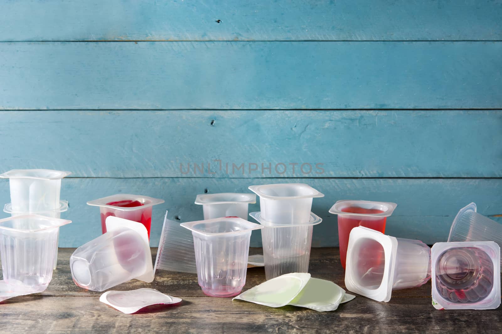 Empty plastic cups of jjellies  by chandlervid85
