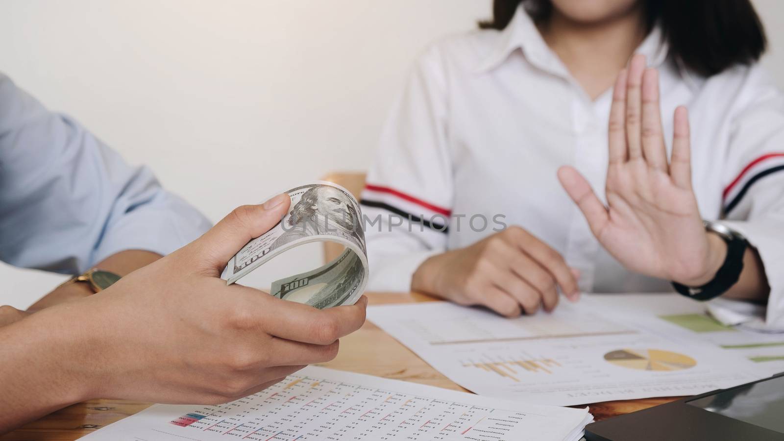 women refusing money to take the bribe the concept of corruption and anti bribery
