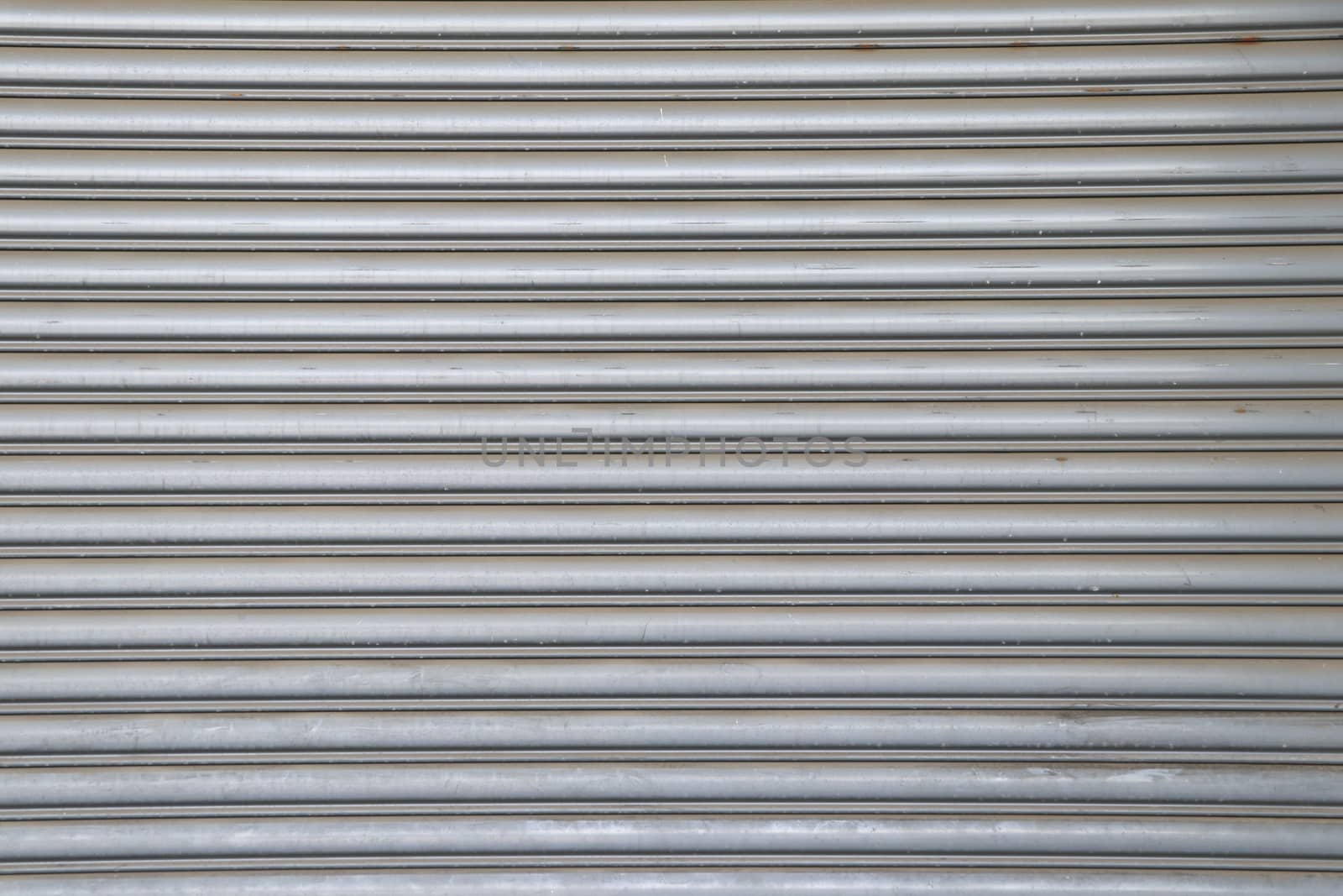 Rolling steel door background. Steel rolling door surface.