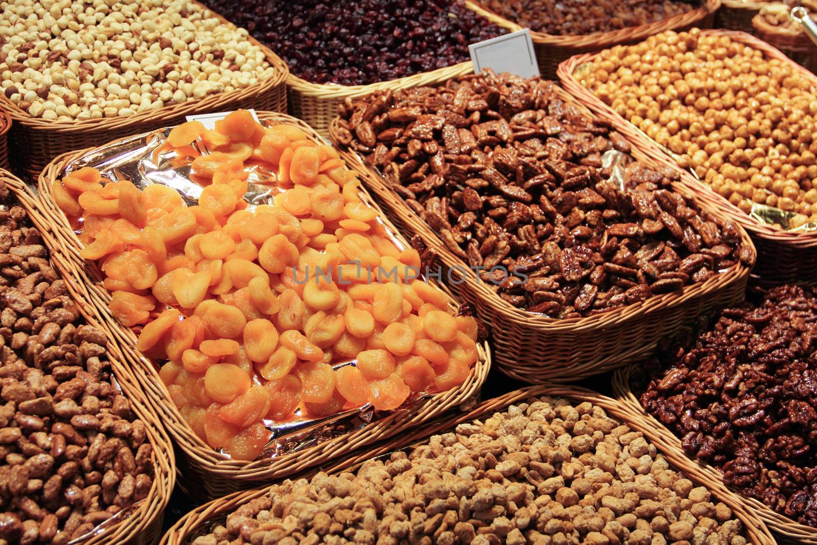 Dry fruits nuts and snacks on the market stall close up