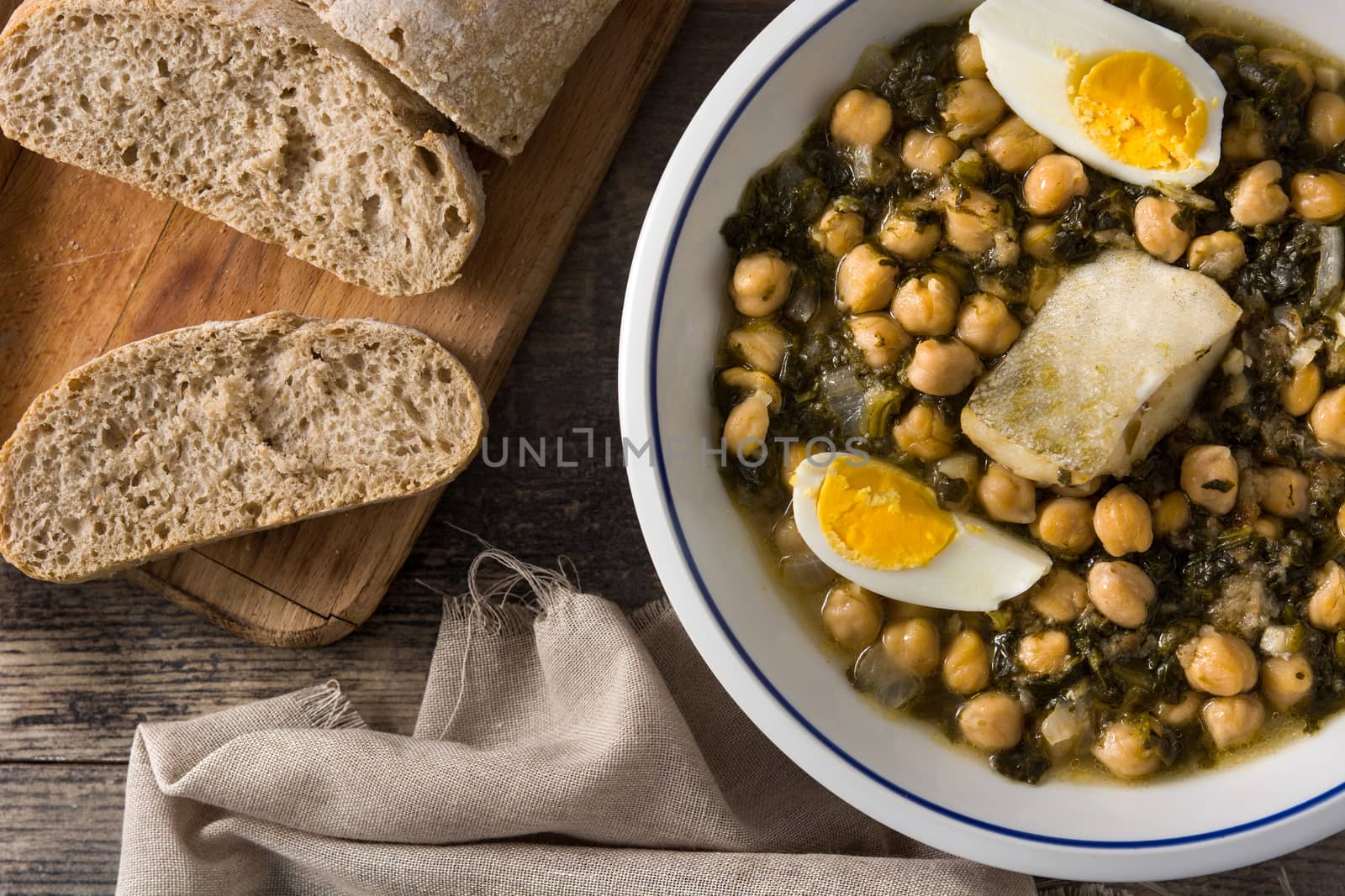 Chickpea stew with spinach and cod or potaje de vigilia. Typical spanish food for Easter holidays.