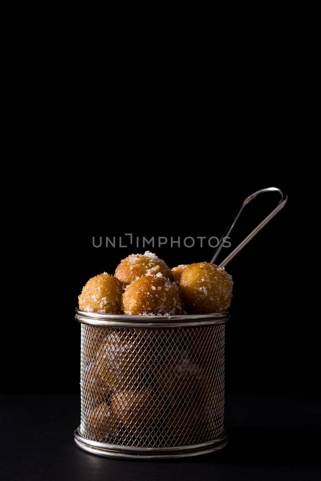 Carnival fritters or buñuelos de viento for holy week on black background