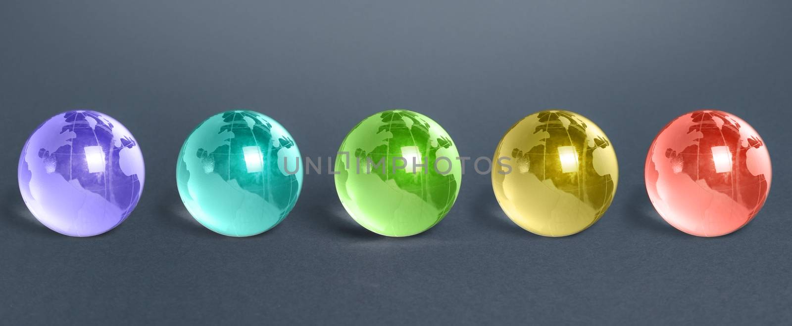 Five multicolored glass globes of planet earth. Globalization and markets. Future forecasts world development. Preservation of the environment. Exoplanets and space exploration. Foreign languages. by iLixe48