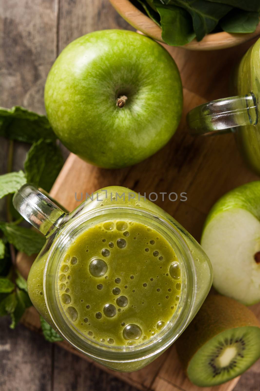 Healthy green smoothie in jar  by chandlervid85