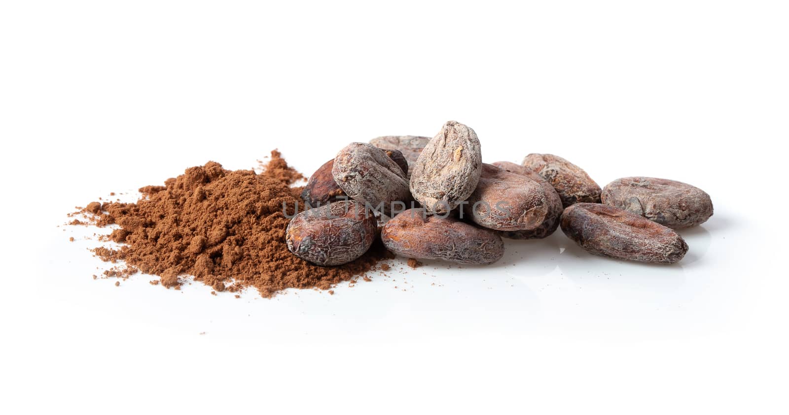 Pile cocoa powder isolated over white background.