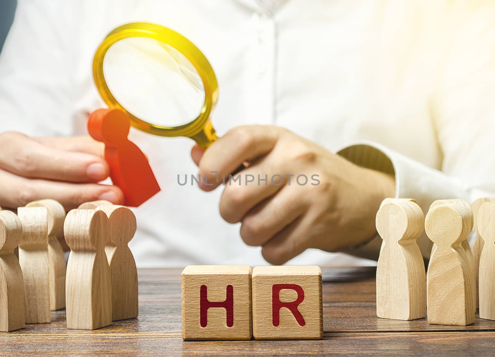 Men employer examining a potential employee candidate with a magnifying glass. Recruiting new workers, headhunters Human resources. Search for talented worker. Checking skills qualities.