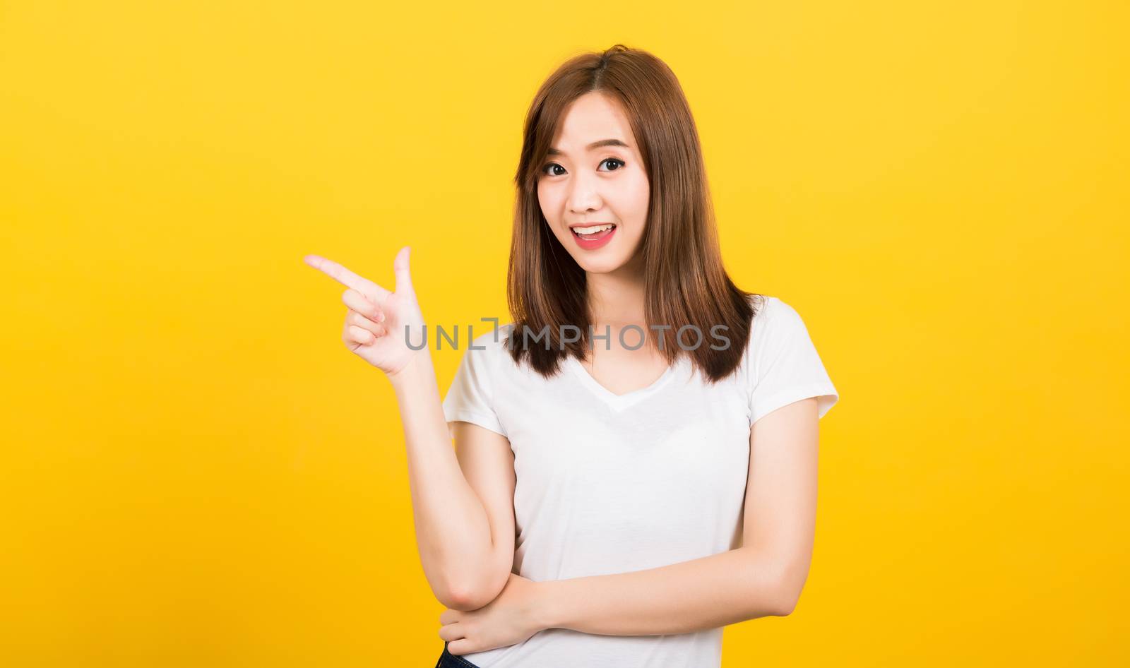 woman teen standing wear t-shirt pointing finger away side by Sorapop