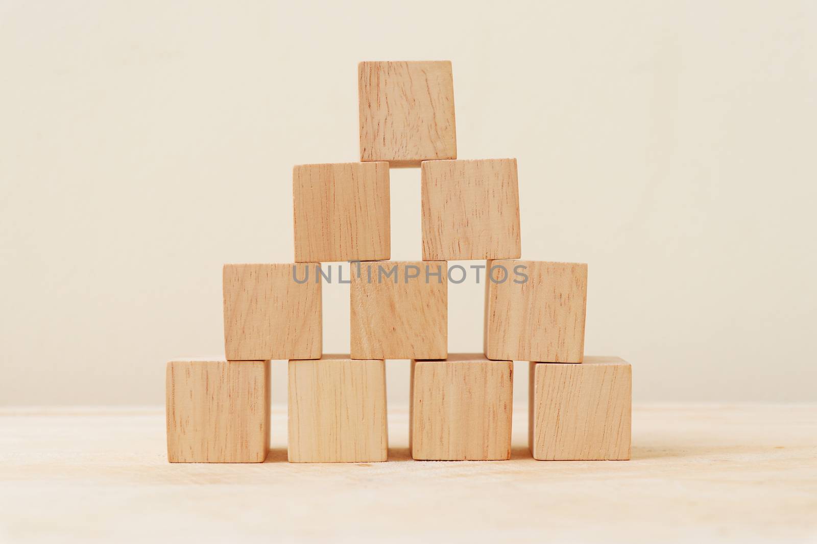 Wooden cube stacked into a pyramid.