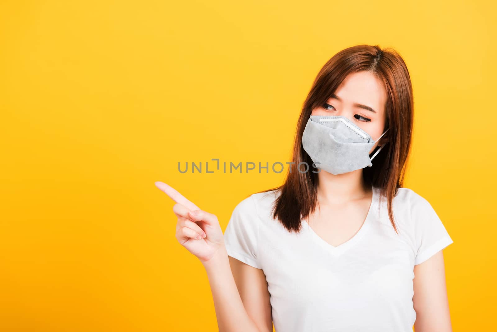 woman wearing face mask protects filter dust pm2.5 anti-pollutio by Sorapop