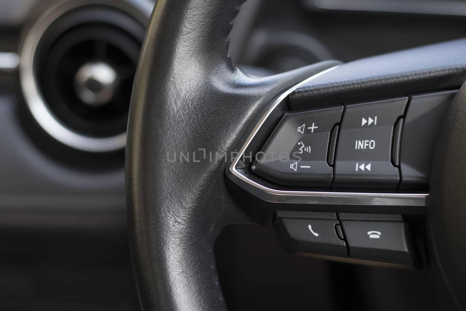 Control panel at the steering wheel for control the use of various applications in the car. by Eungsuwat