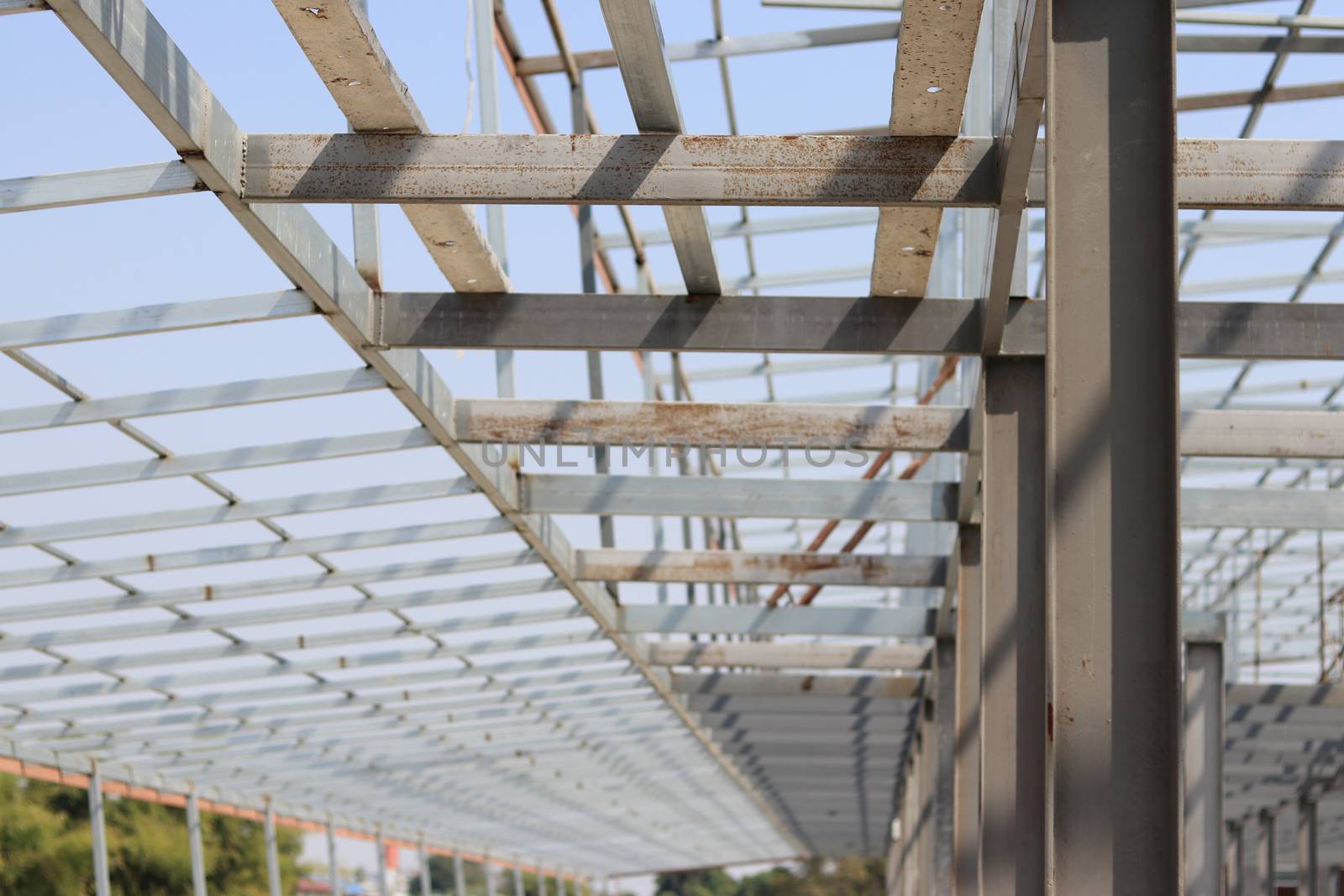 Steel structure for roof installation. Gray iron structure of construction site