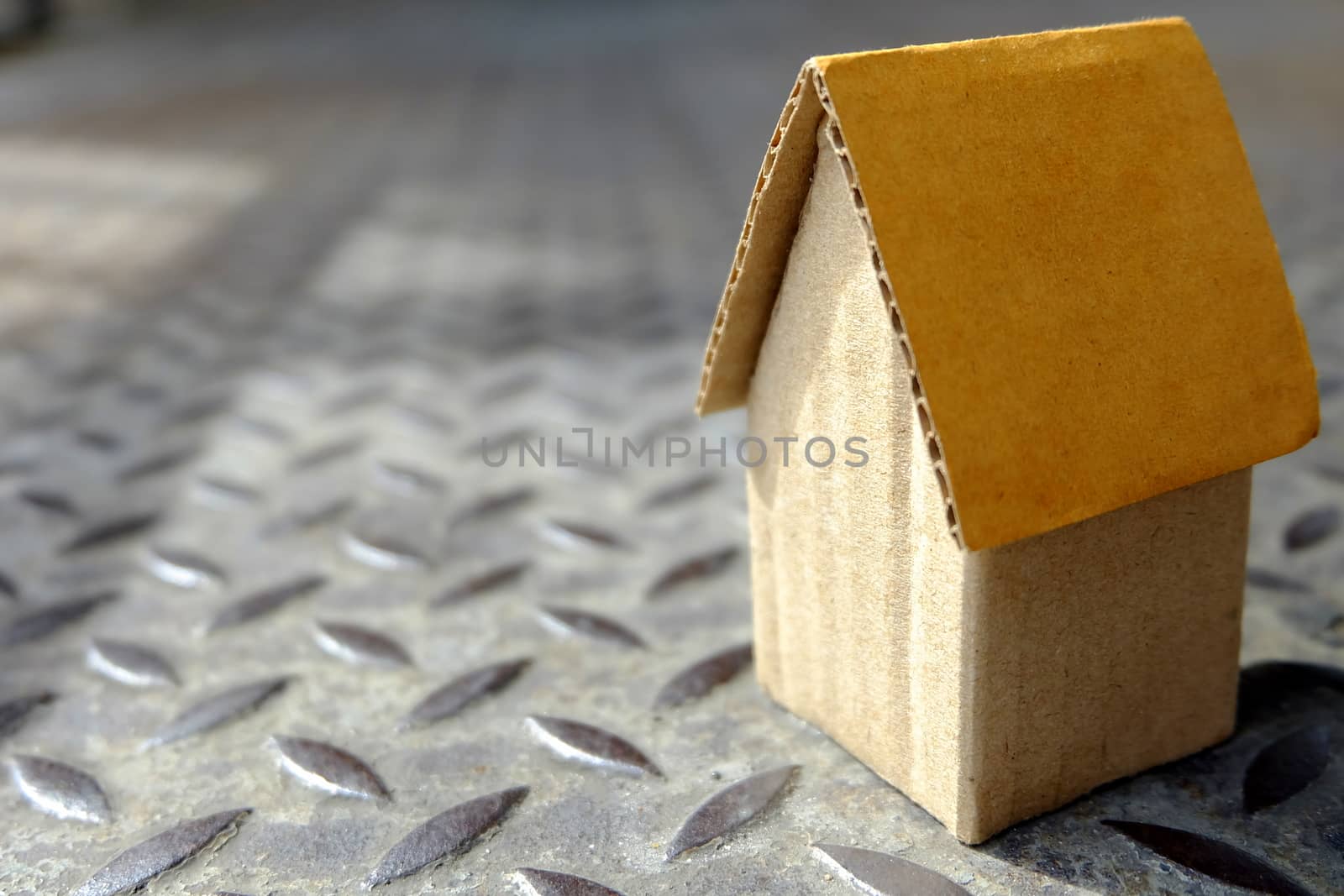 Close up Cardboard House on Dimond Metal Plate. by mesamong