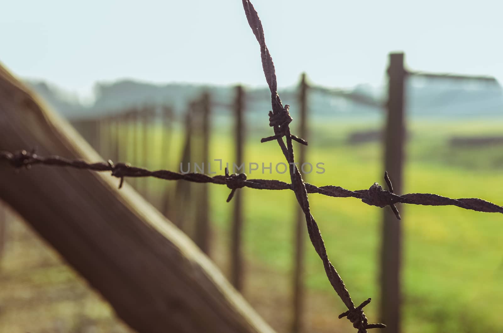 Close up steel fencing Barbed wire in German concentration and extermination camp Majdanek. Lublin, Poland