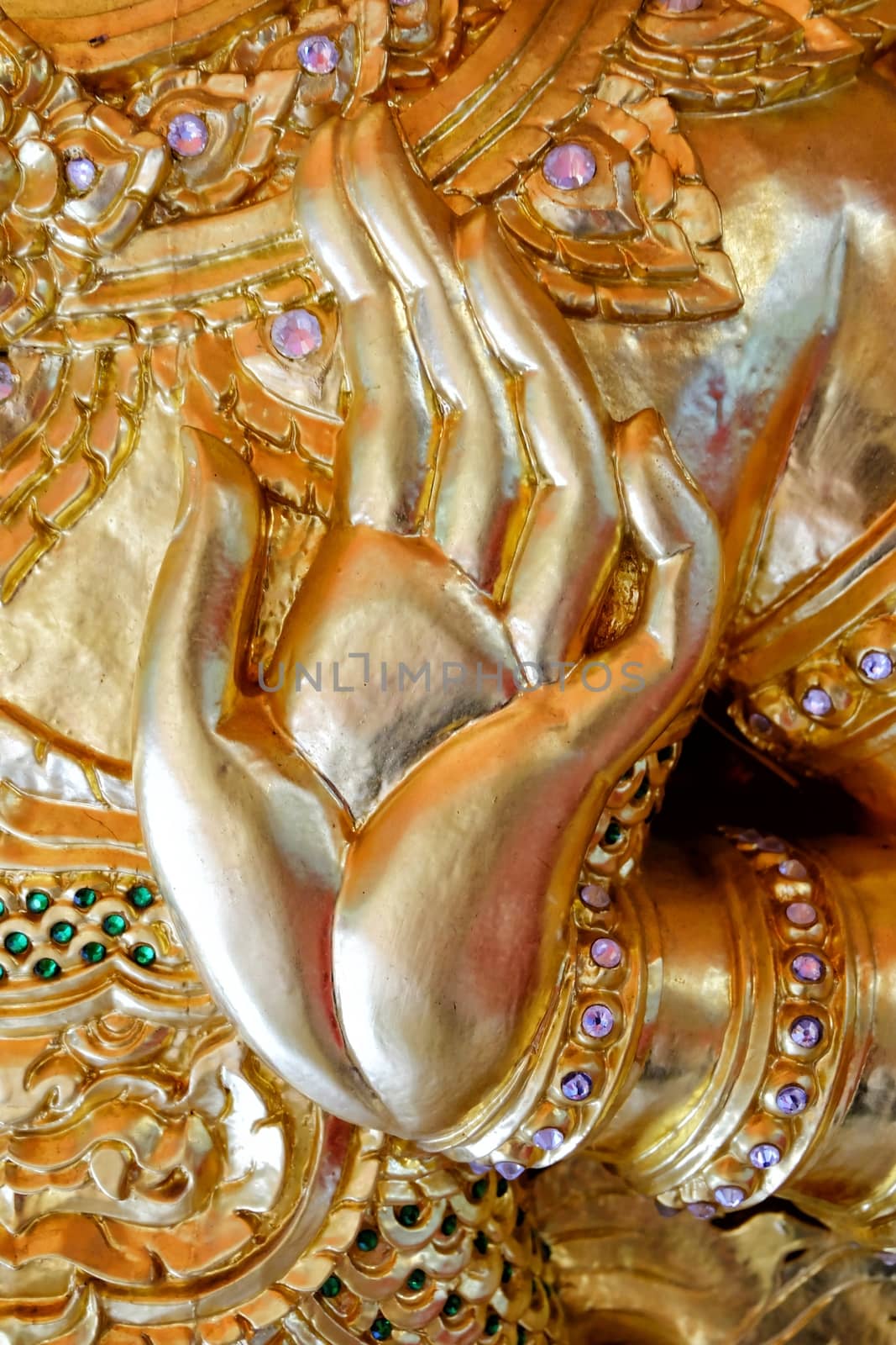 Close up Ancient Golden Hand Sculpture.
