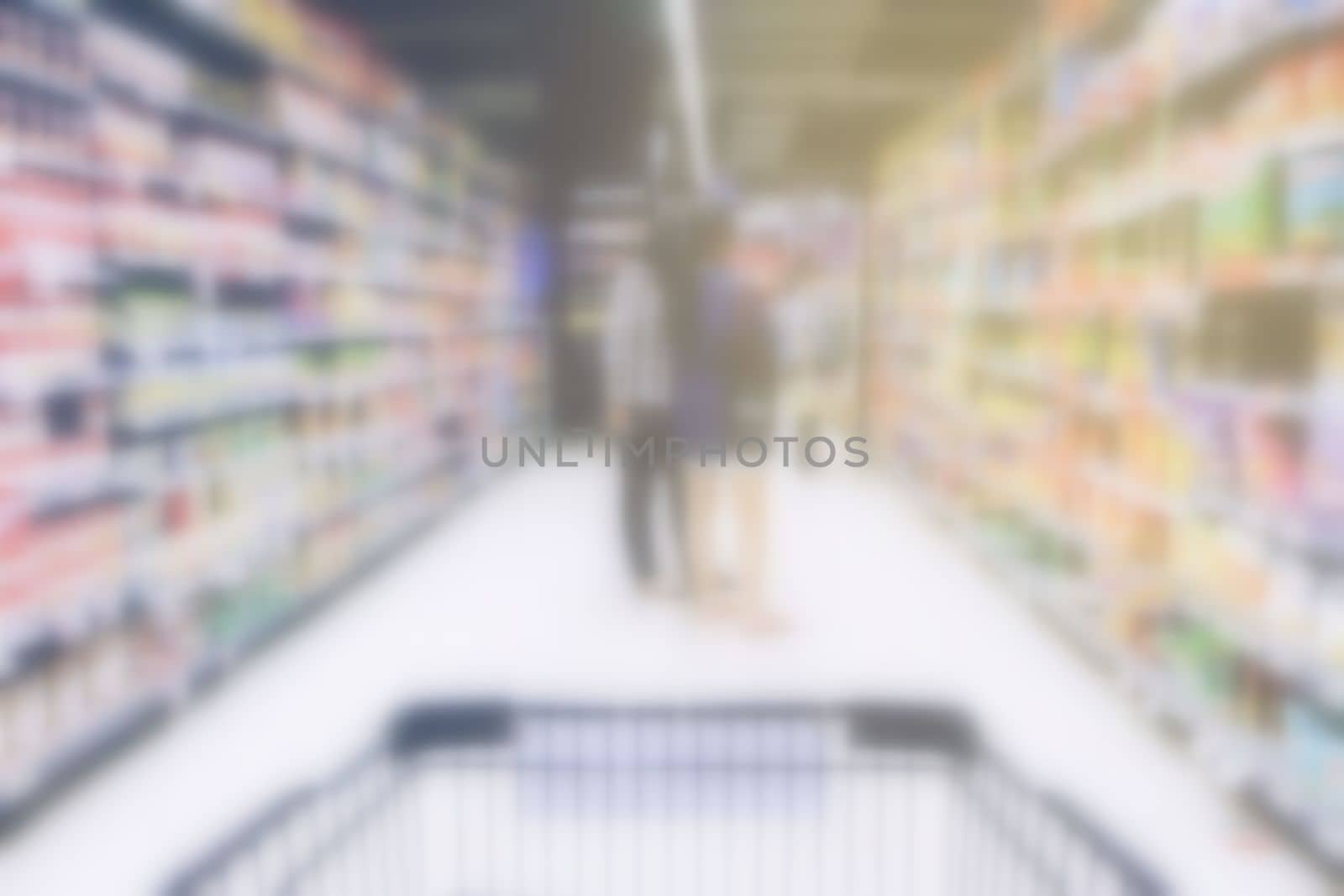 Blurred Shopping Cart in Supermarket.