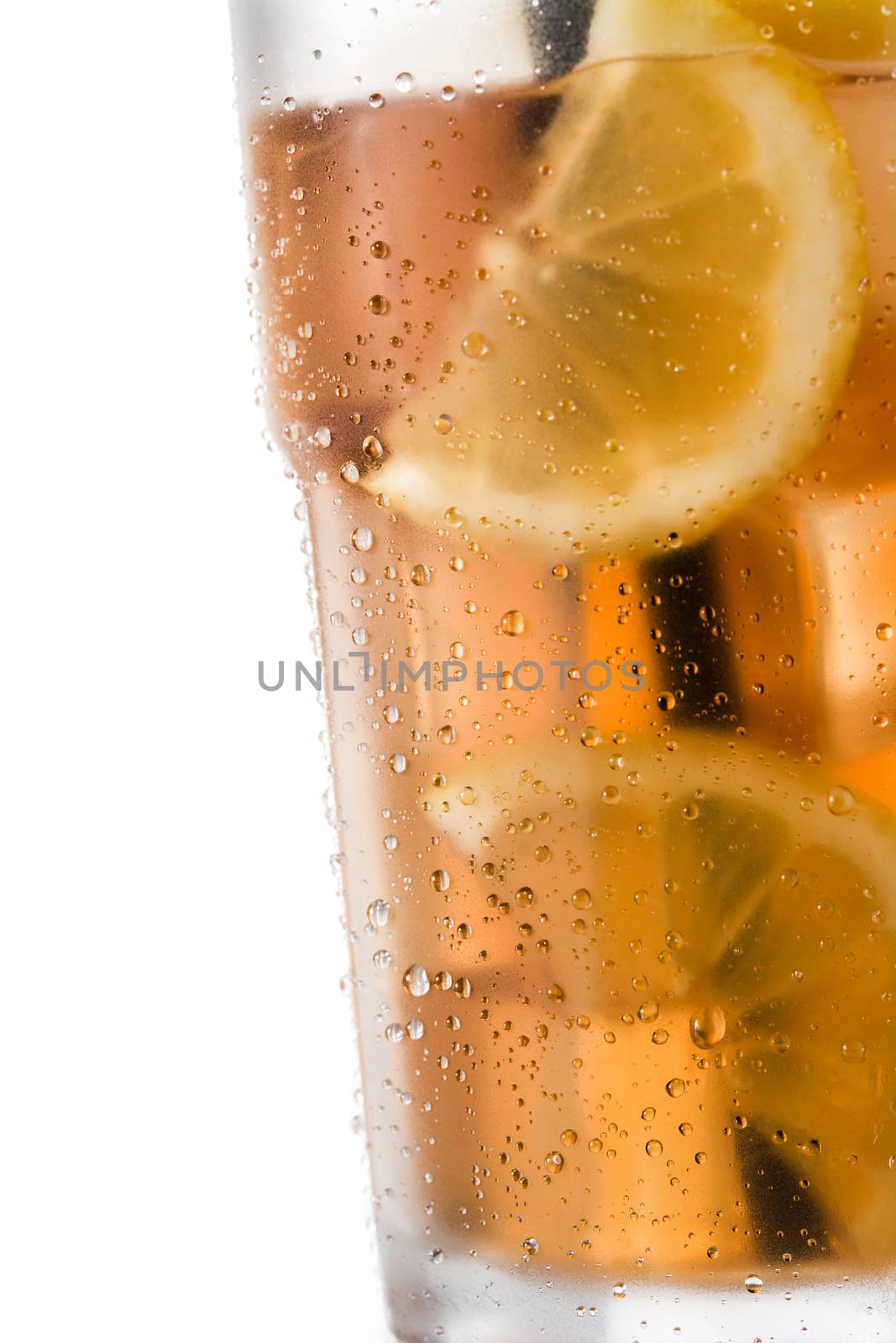 Iced tea drink with lemon in glass by chandlervid85