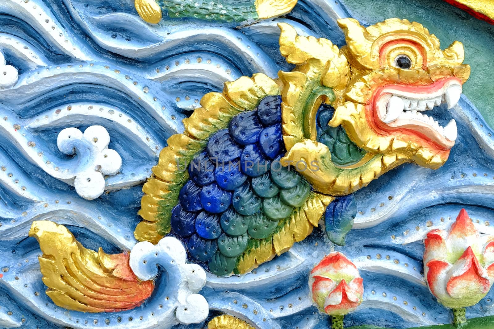 Dragon Fish Sculpture on Thai Temple Wall.