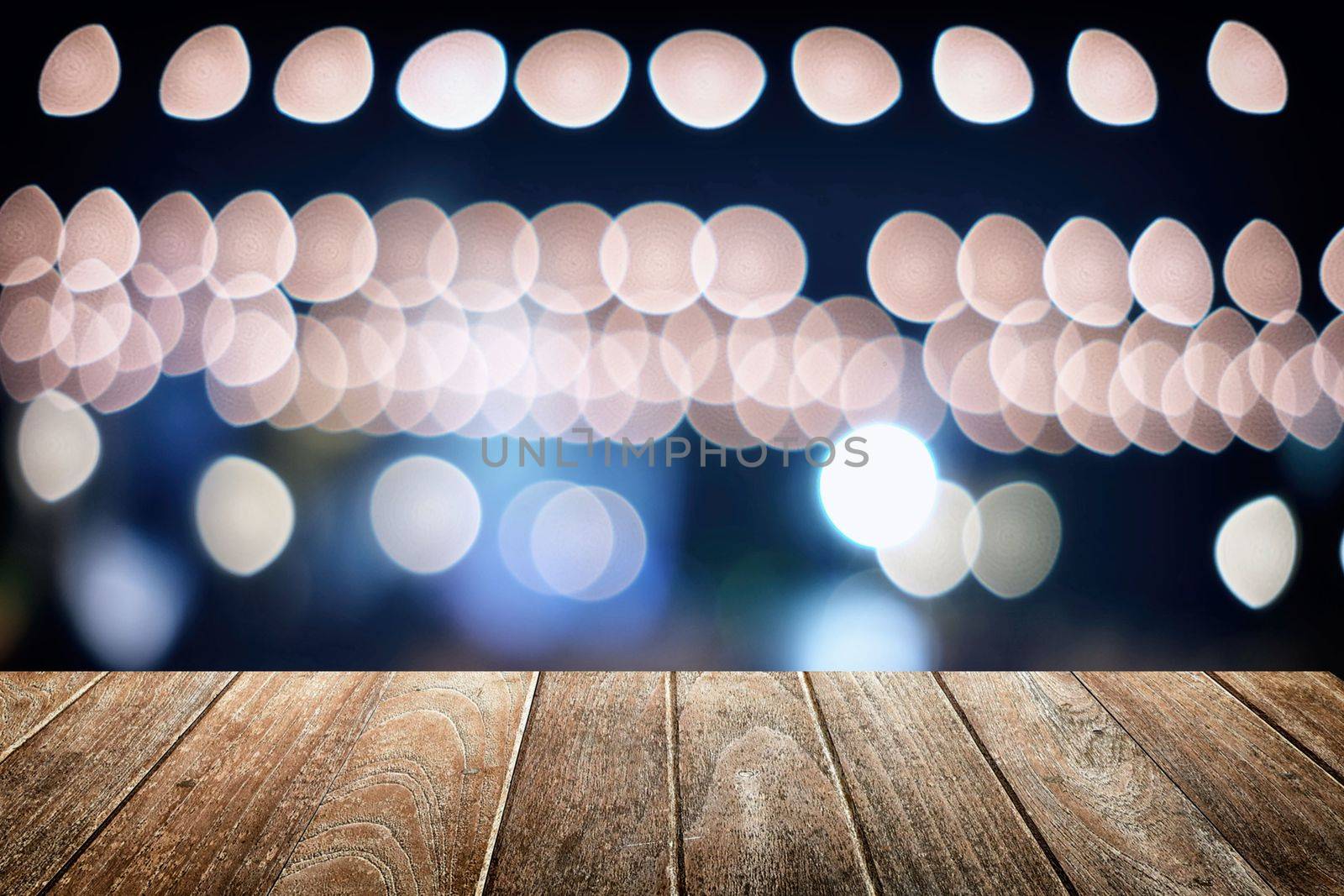 Empty Wooden Board with Abstract Bokeh Background.