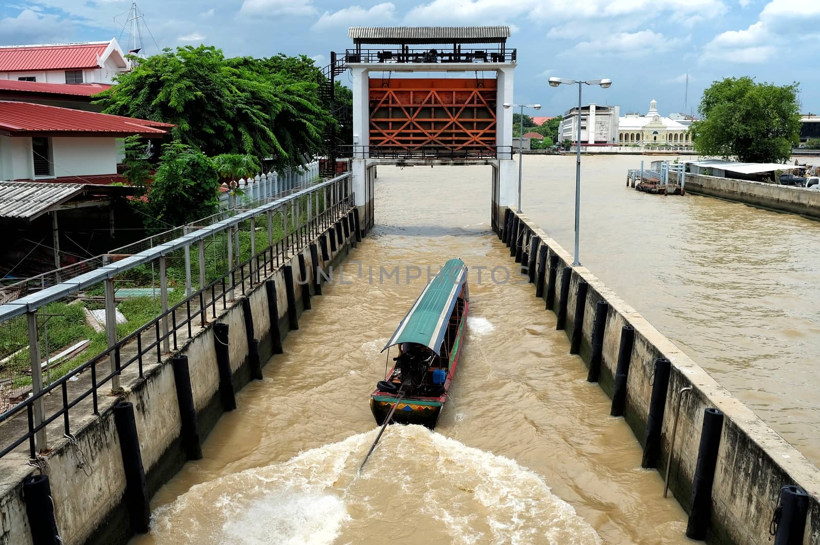 Long Tail Boat in Floodgate at Chao Phraya River.