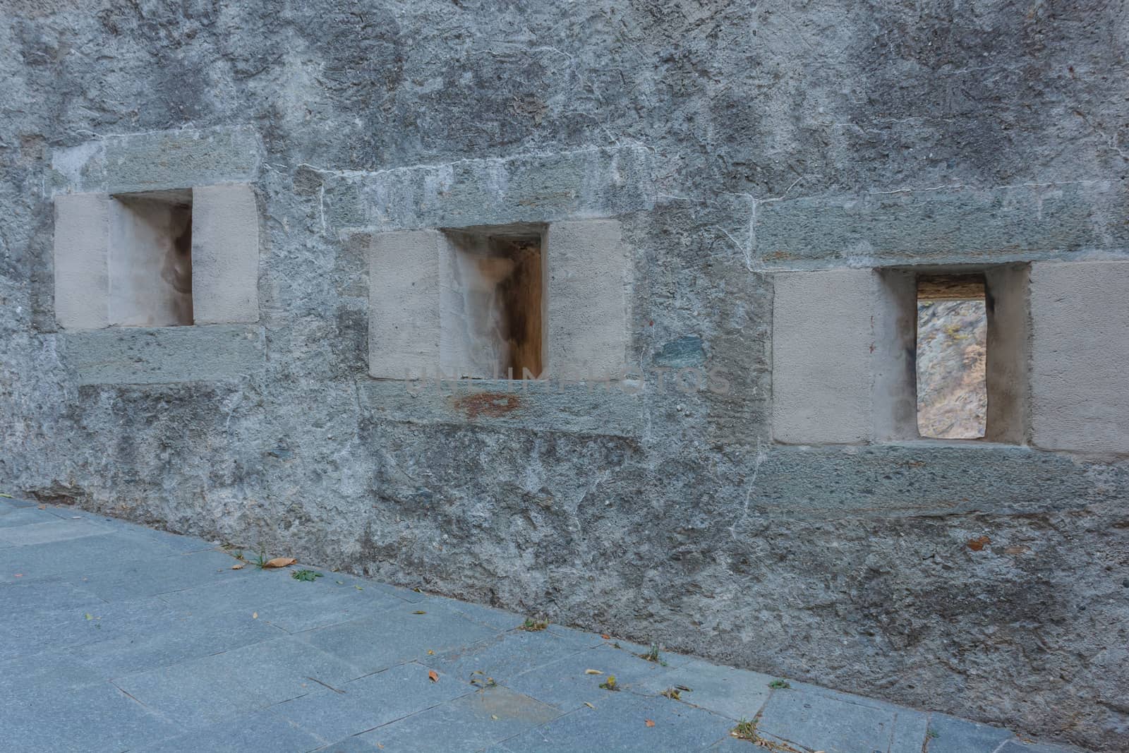 detail of three slits of an old castle by moorea