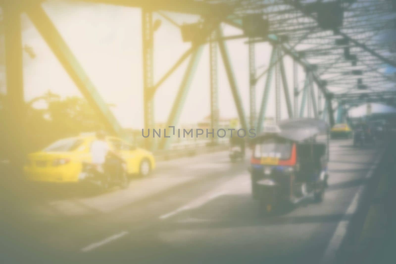 Blurred Tuk Tuk Taxi on Memorial Bridge, Bangkok Thailand. by mesamong