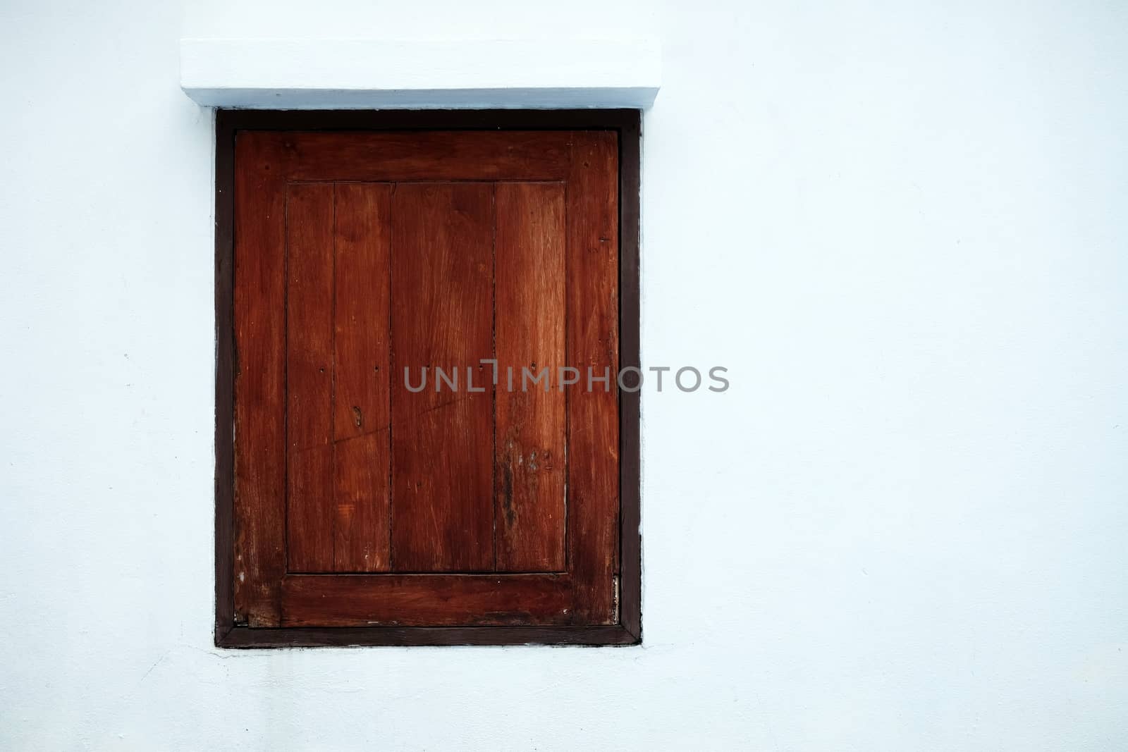 Old Wood Window on White Concrete Wall Background.