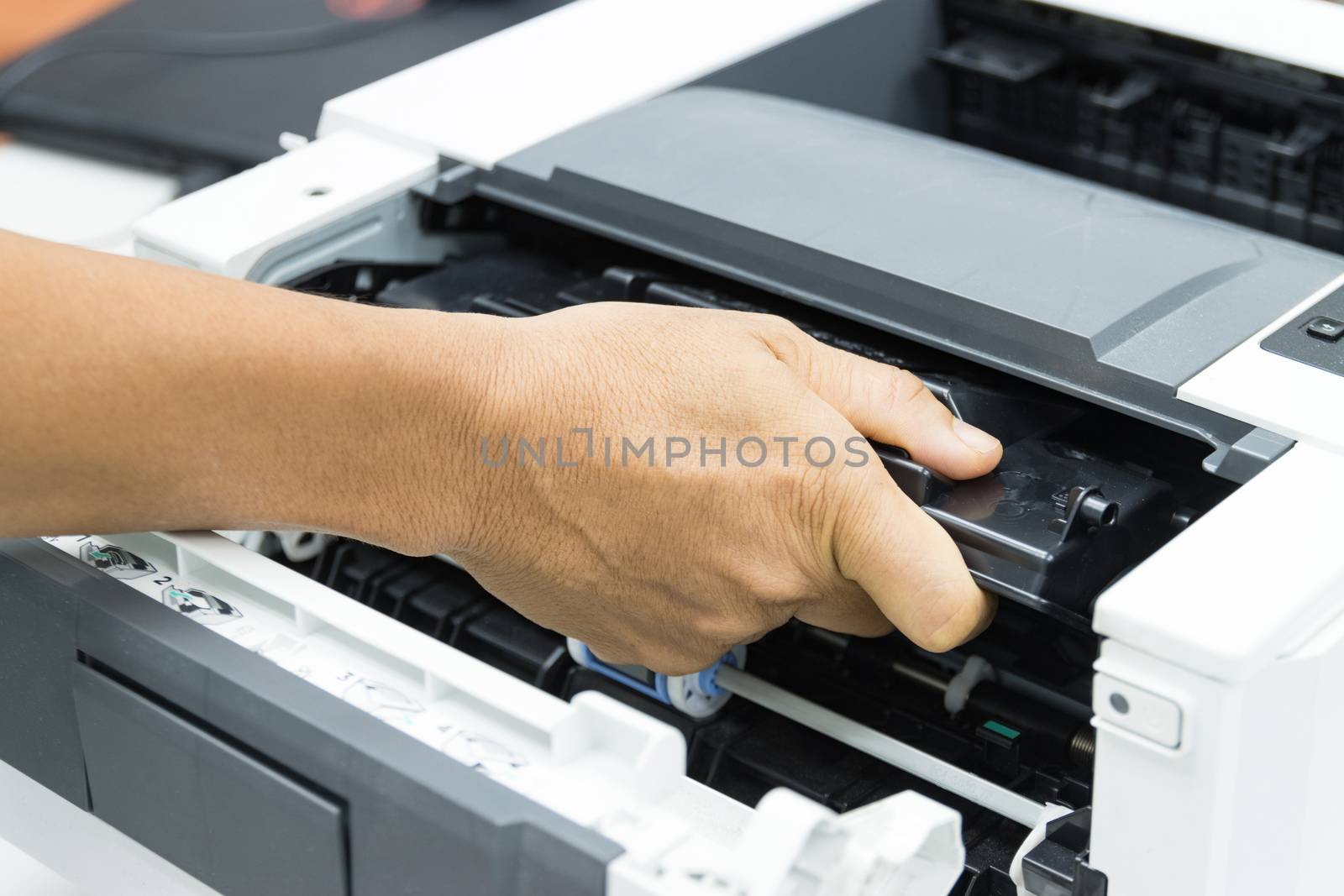 Technicians replacing toner in laser printer concept office supplies repair