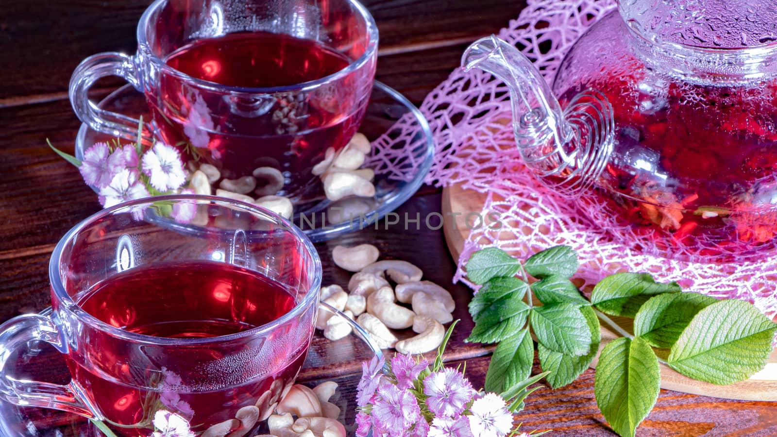 Mugs of red tea with carnation flowers. Zen tea ceremony. Englis by YevgeniySam