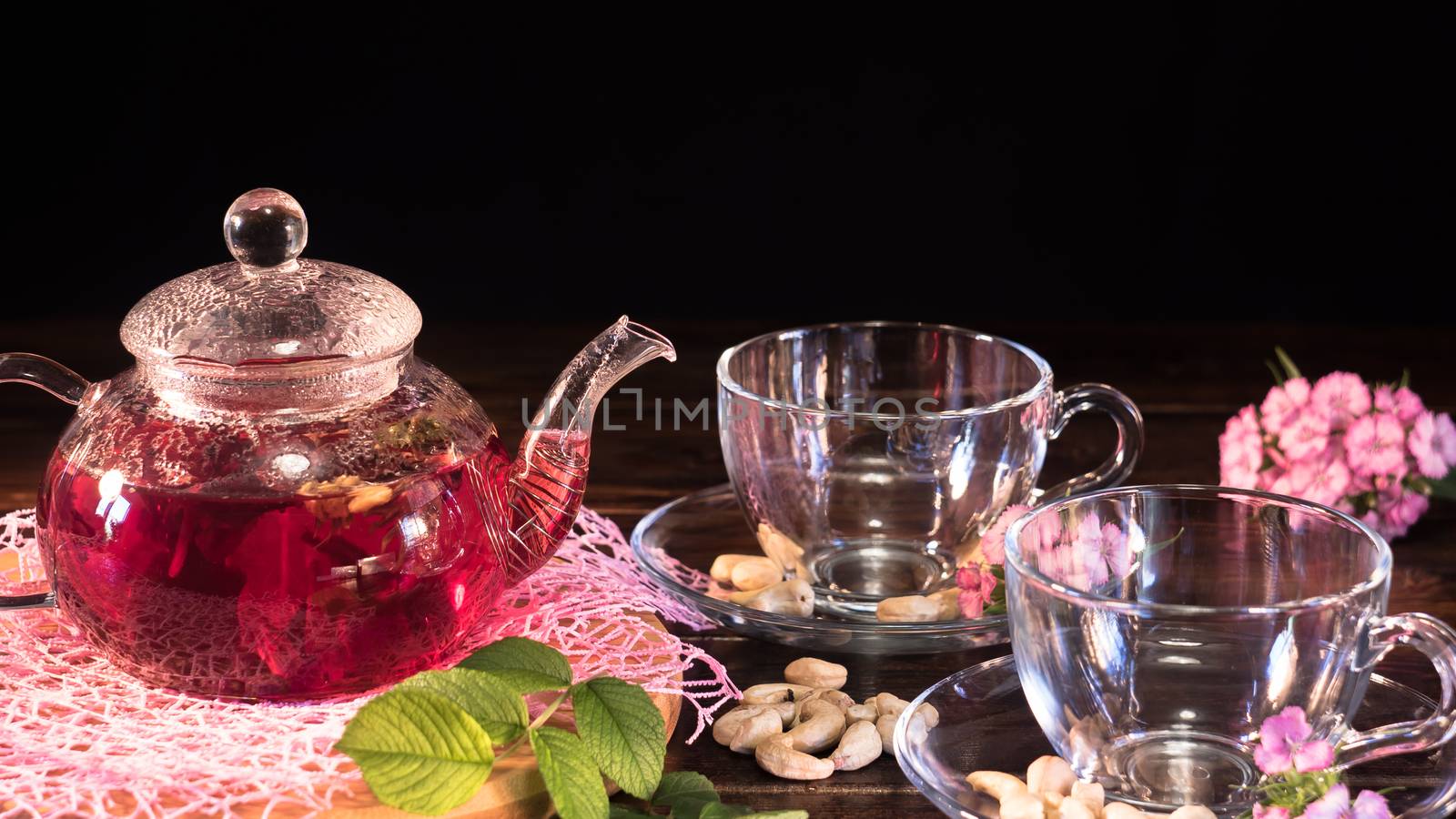 Teapot with red tea.Medicinal therapy on medicinal herbs and dec by YevgeniySam