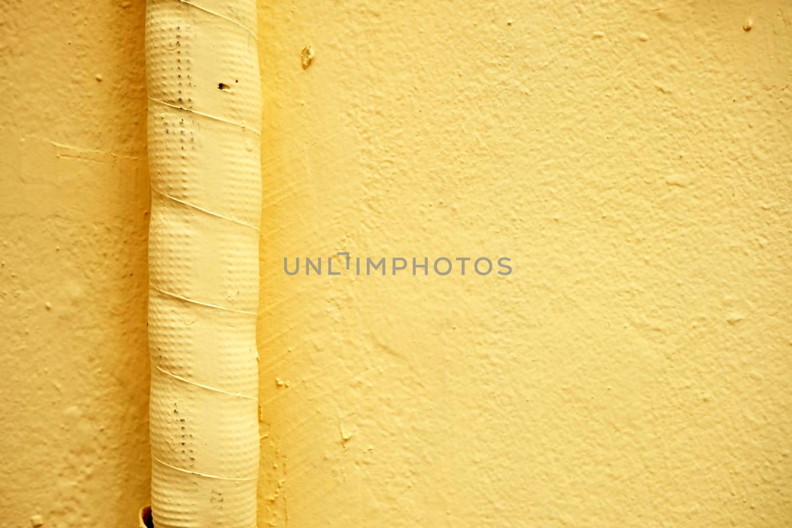 Air Duct on Yellow Paint Concrete Wall. by mesamong