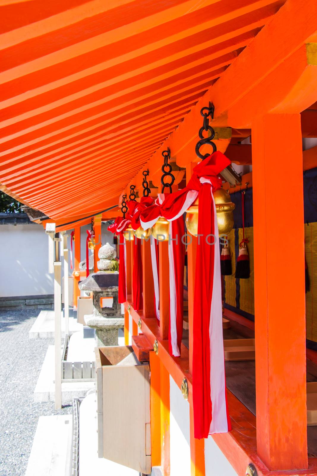 Japanese bell tie with fabric inside the Fushimi Inari Shrine is the famous Shinto shrine in Kyoto, Japan.