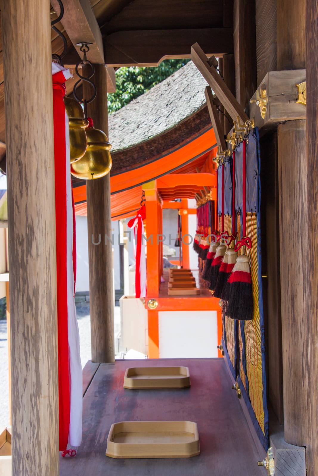 Japanese bell tie with fabric inside the Fushimi Inari Shrine is the famous Shinto shrine in Kyoto, Japan.