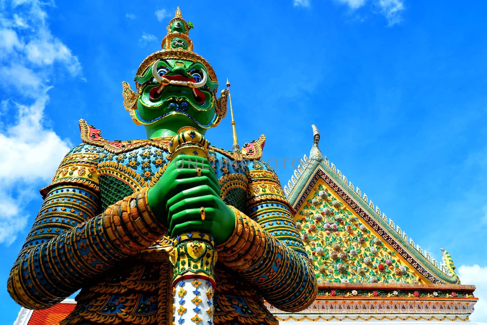 Siamese Giant Statue Standing in front of Thai Temple.