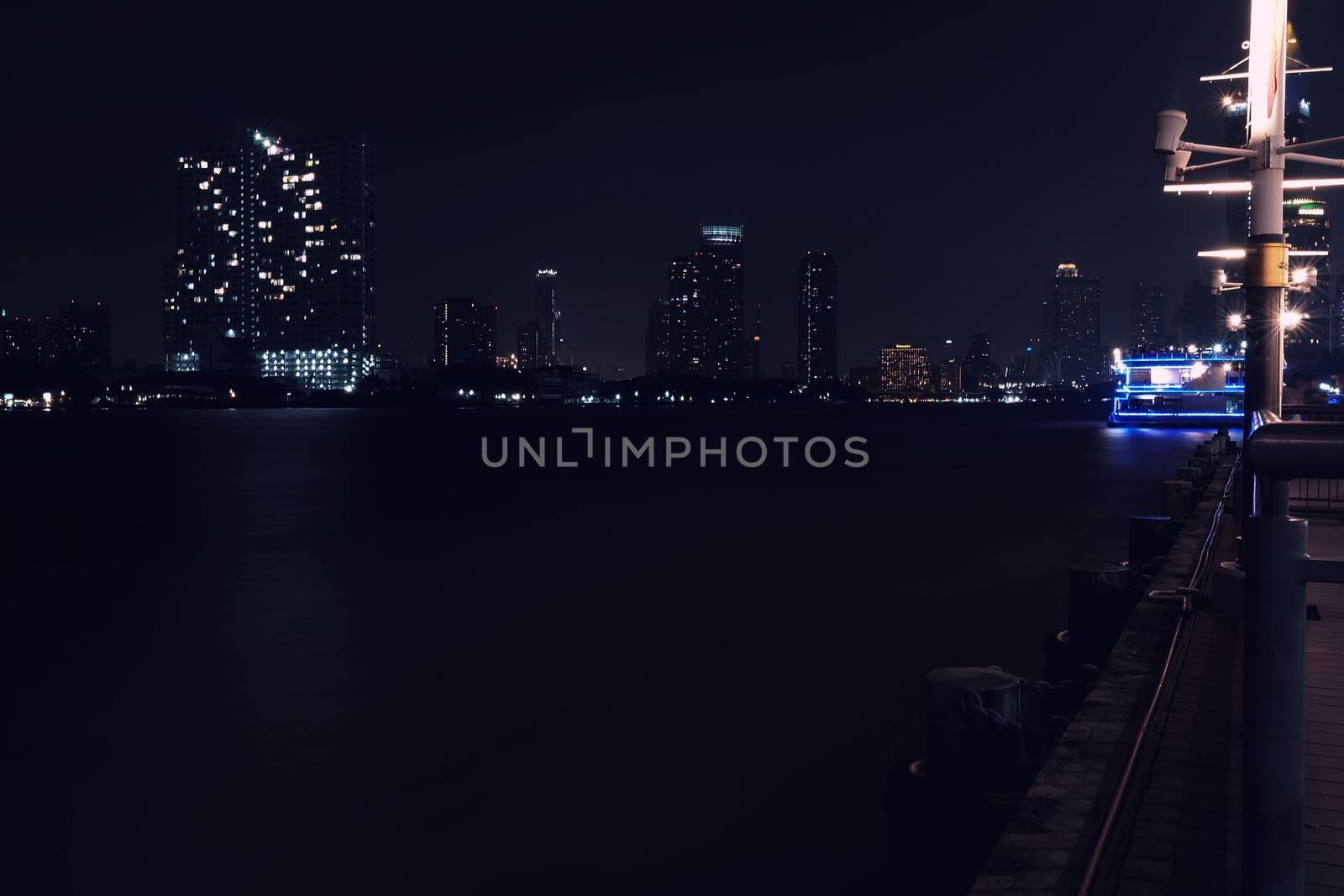 Scenery of NIght at Chaophraya River at Asiatique Market Pier. Chaophraya River is the major river in Bangkok, Thailand.