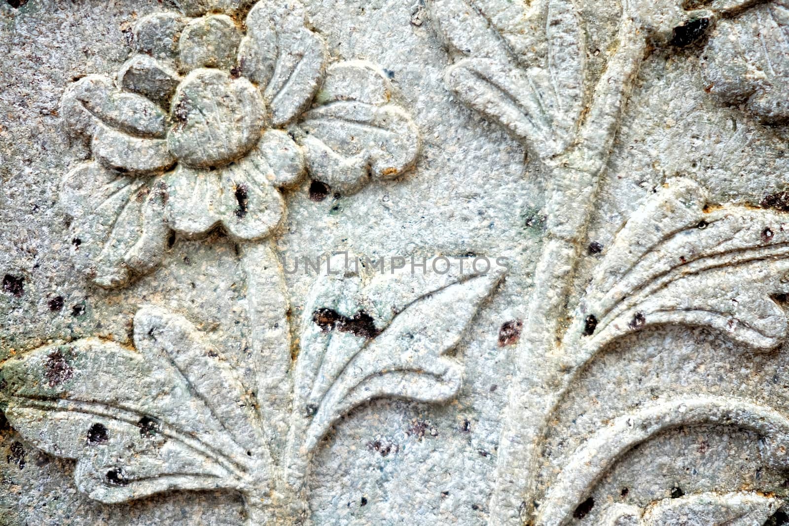 Vintage Thai Sculpture on Stone Wall.