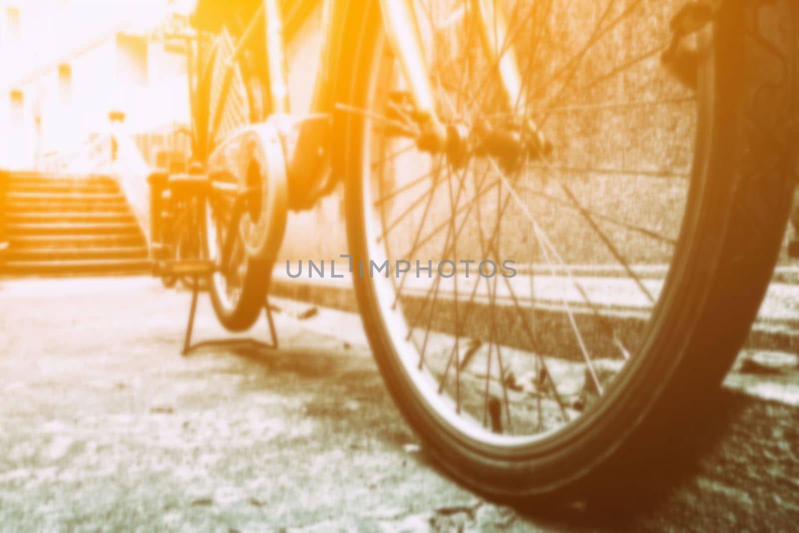 Close-up Blurred Bicycle Parking on Road with Light Leak. by mesamong
